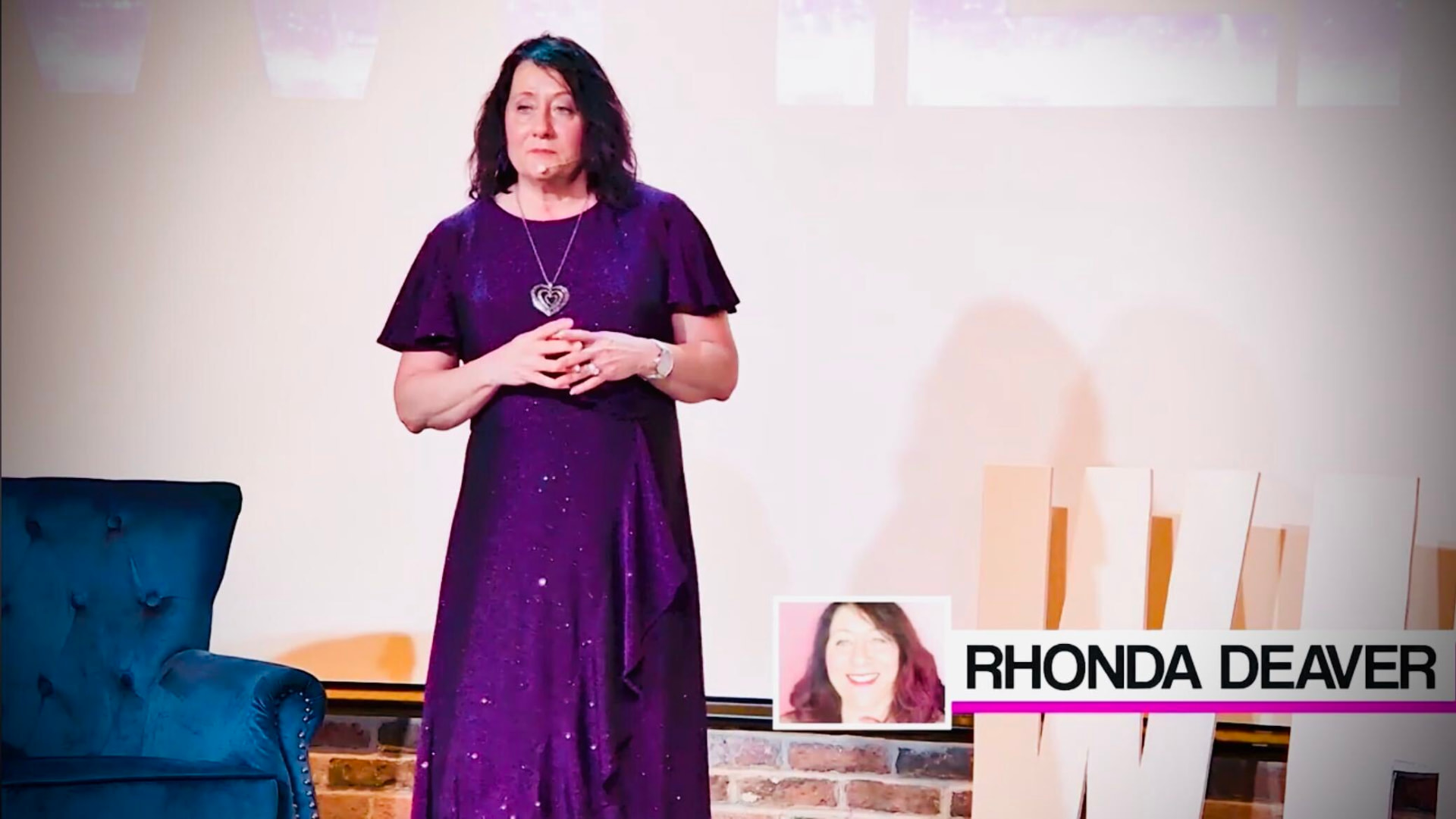 Rhonda Deaver addressing an audience on stage
